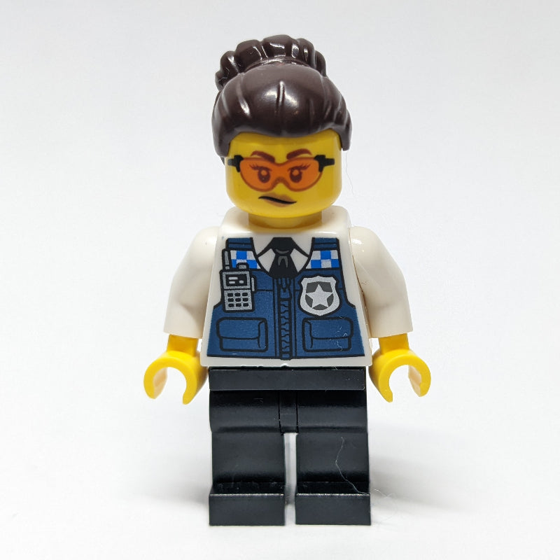 fig-012024 – Gracie Goodhart, Dark Blue Police Vest, Dark Brown Hair