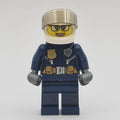 fig-012064 – Policewoman, Dark Blue Uniform, White Helmet