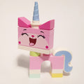 fig-012265 – Unikitty, Light Aqua Foot, Closed Eyes, Tongue Sticking Out