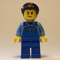 fig-012623 – Woman, Blue Overalls, Dark Brown Hair