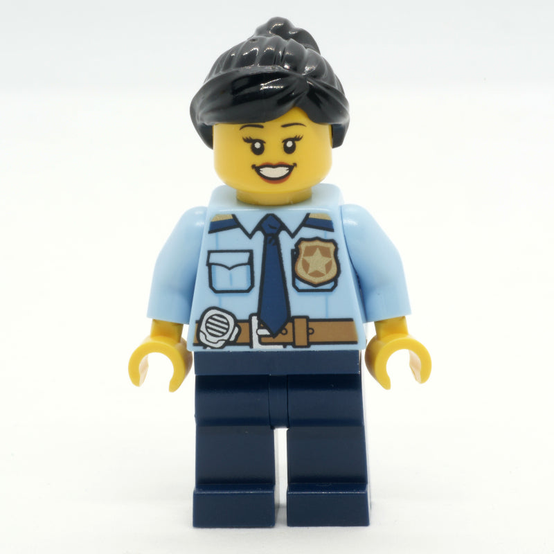 fig-013348 – Police Officer, Bright Light Blue Shirt with Police Badge, Dark Blue Legs, Reddish Brown Ponytail