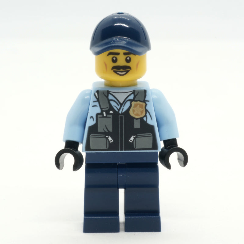 fig-013351 – Police Officer, Bright Light Blue Shirt with Police Badge, Dark Blue Legs and Cap, Moustache