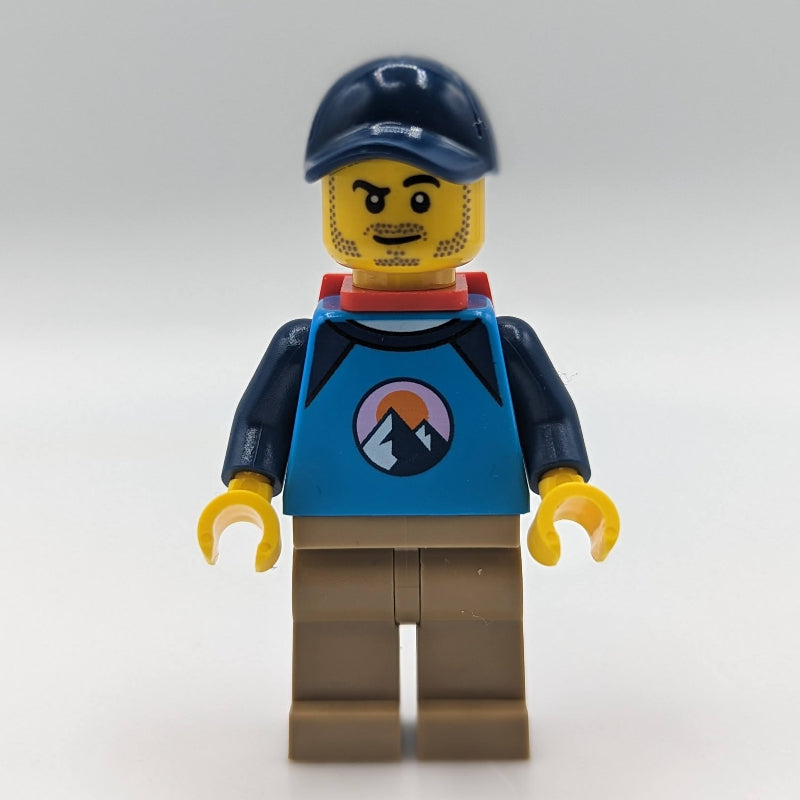 fig-013360 – Dirt Bike Rider, Male - Dark Azure Top, Dark Tan Legs, Red Backpack, Dark Blue Cap