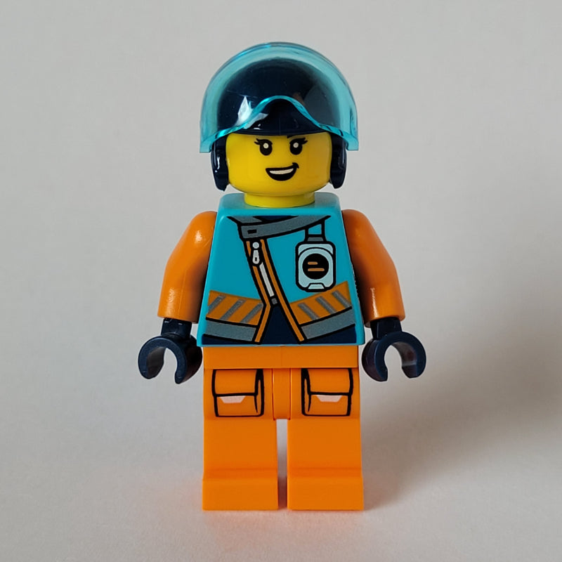 fig-013974 – Arctic Explorer Pilot, Iris Icicle, Medium Azure and Orange Suit, Dark Blue Helmet