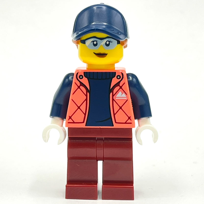 fig-013981 – Woman, Coral Jacket, Dark Red Legs, Dark Blue Cap with Hair
