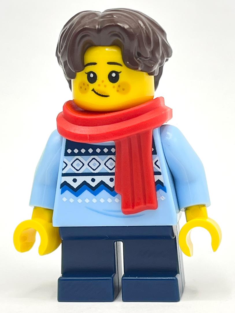 fig-014384 – Child, Bright Light Blue Sweater, Short Dark Blue Legs, Red Scarf, Dark Brown Hair