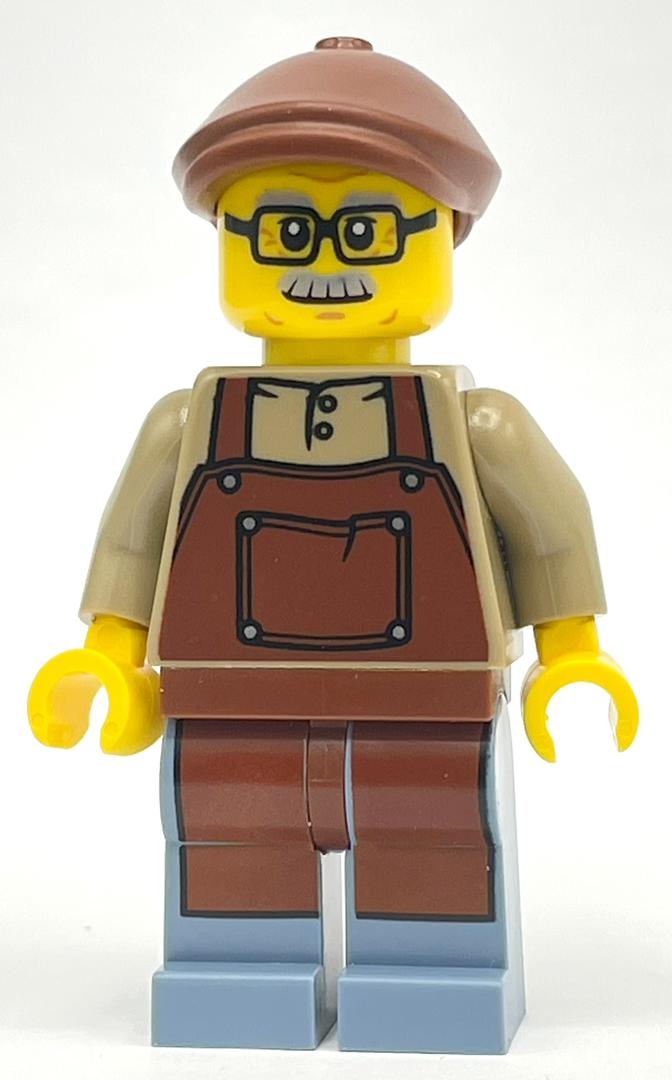 fig-014385 – Man, Dark Tan Shirt with Reddish Brown Apron, Glasses and Moustache, Reddish Brown Hat
