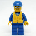 fig-016117 – Racer, Blue Jumpsuit with Octan Logo, Blue Cap, Yellow Life Vest 97895, Silver Sunglasses