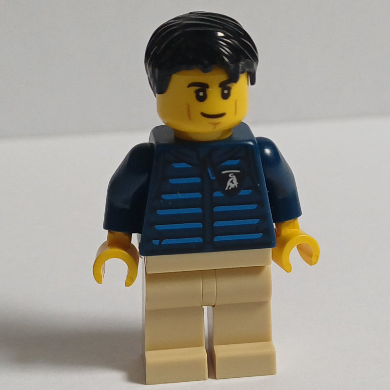 fig-016685 – Lamborghini Driver, Dark Blue Torso, Tan Legs, Black Hair